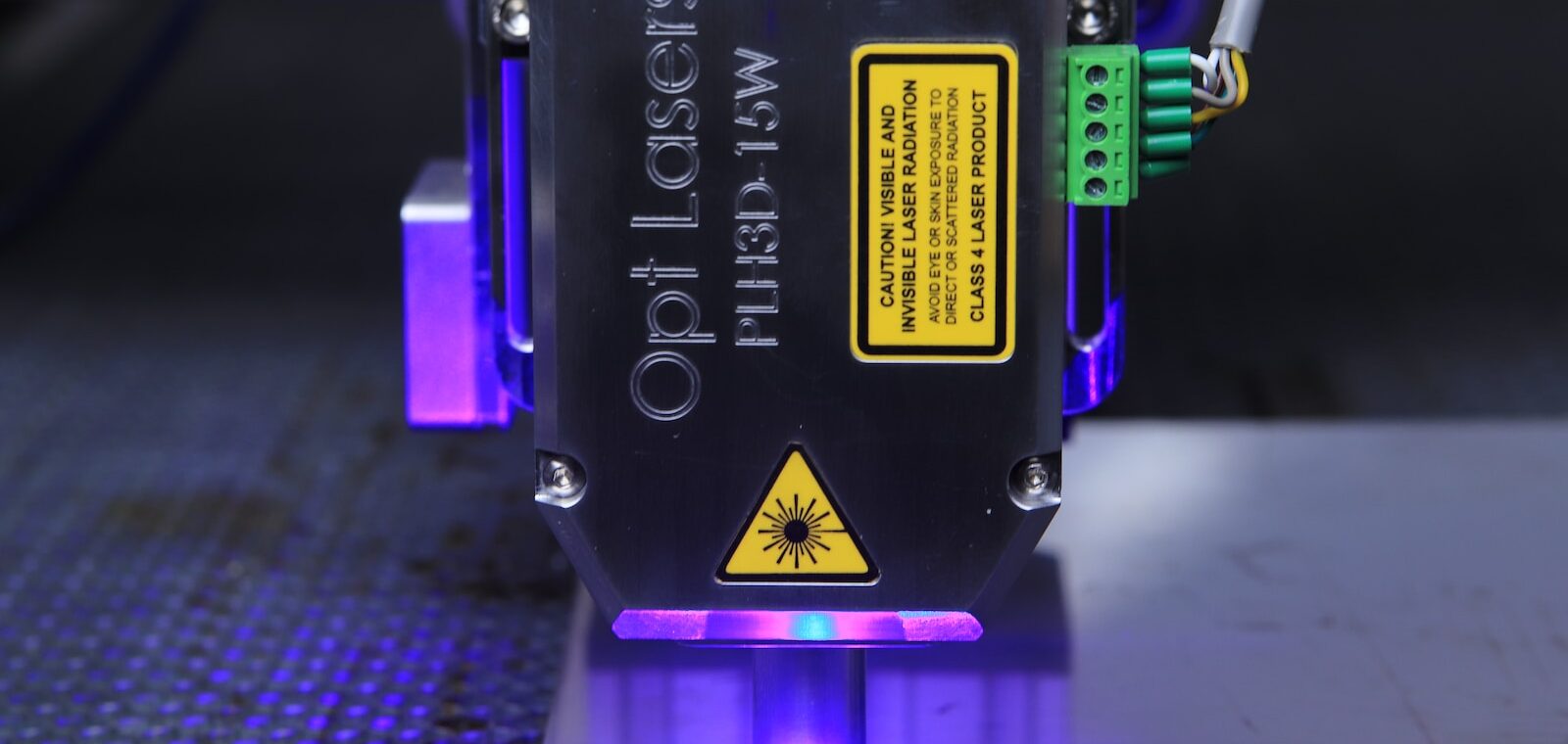 a close up of a machine with a purple light